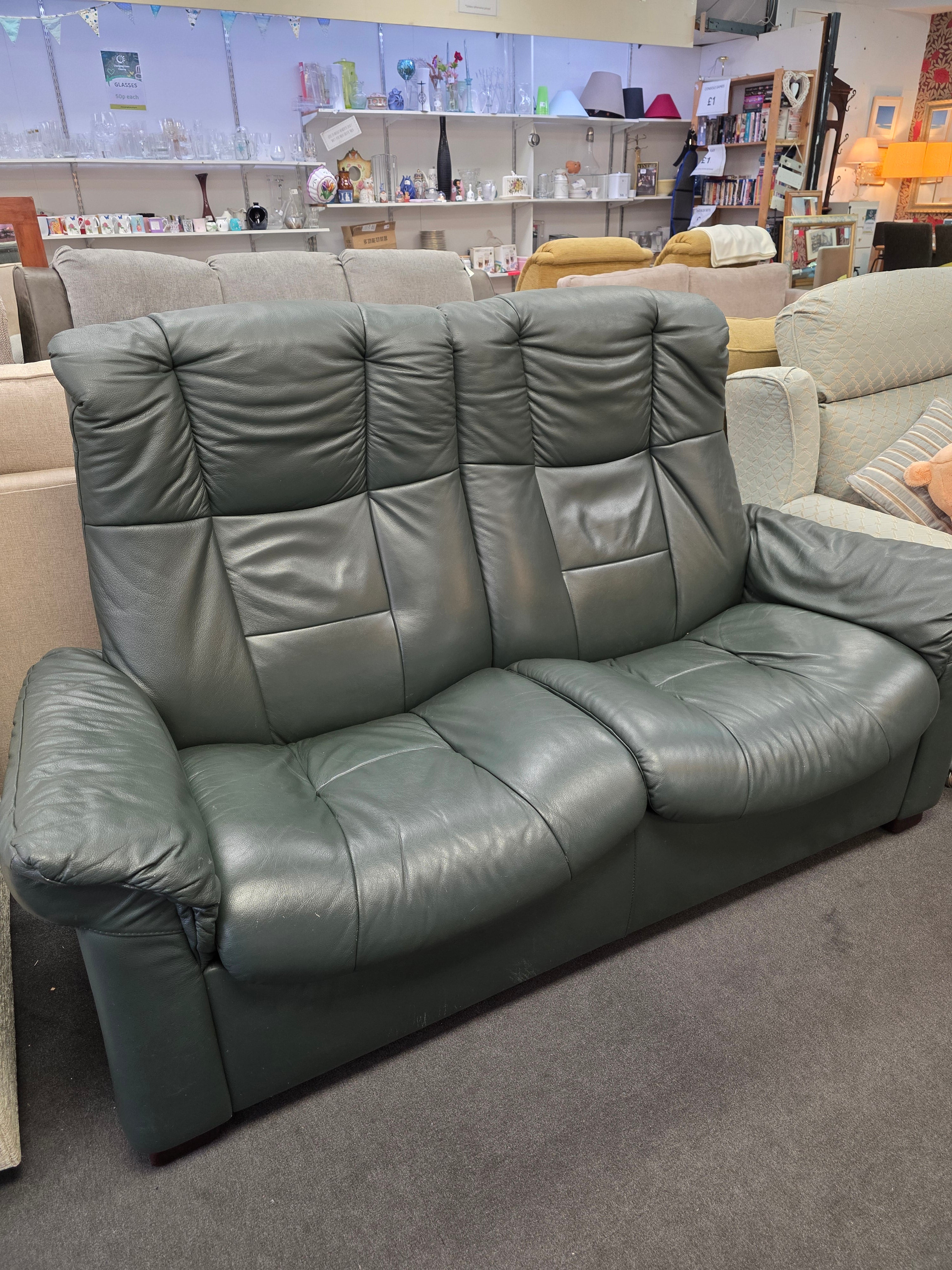 Green Leather 2 seater sofa.