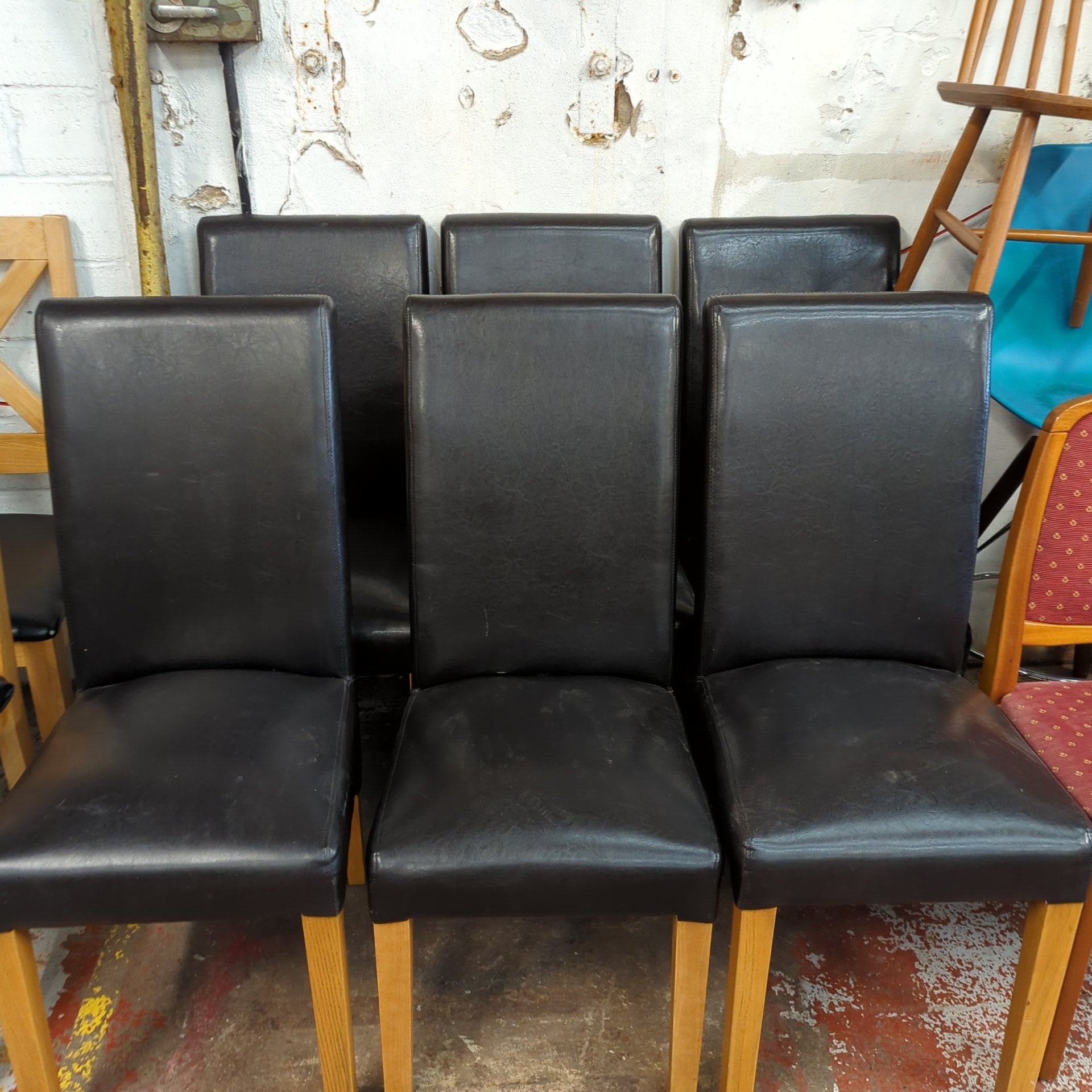 Six Leather Chairs