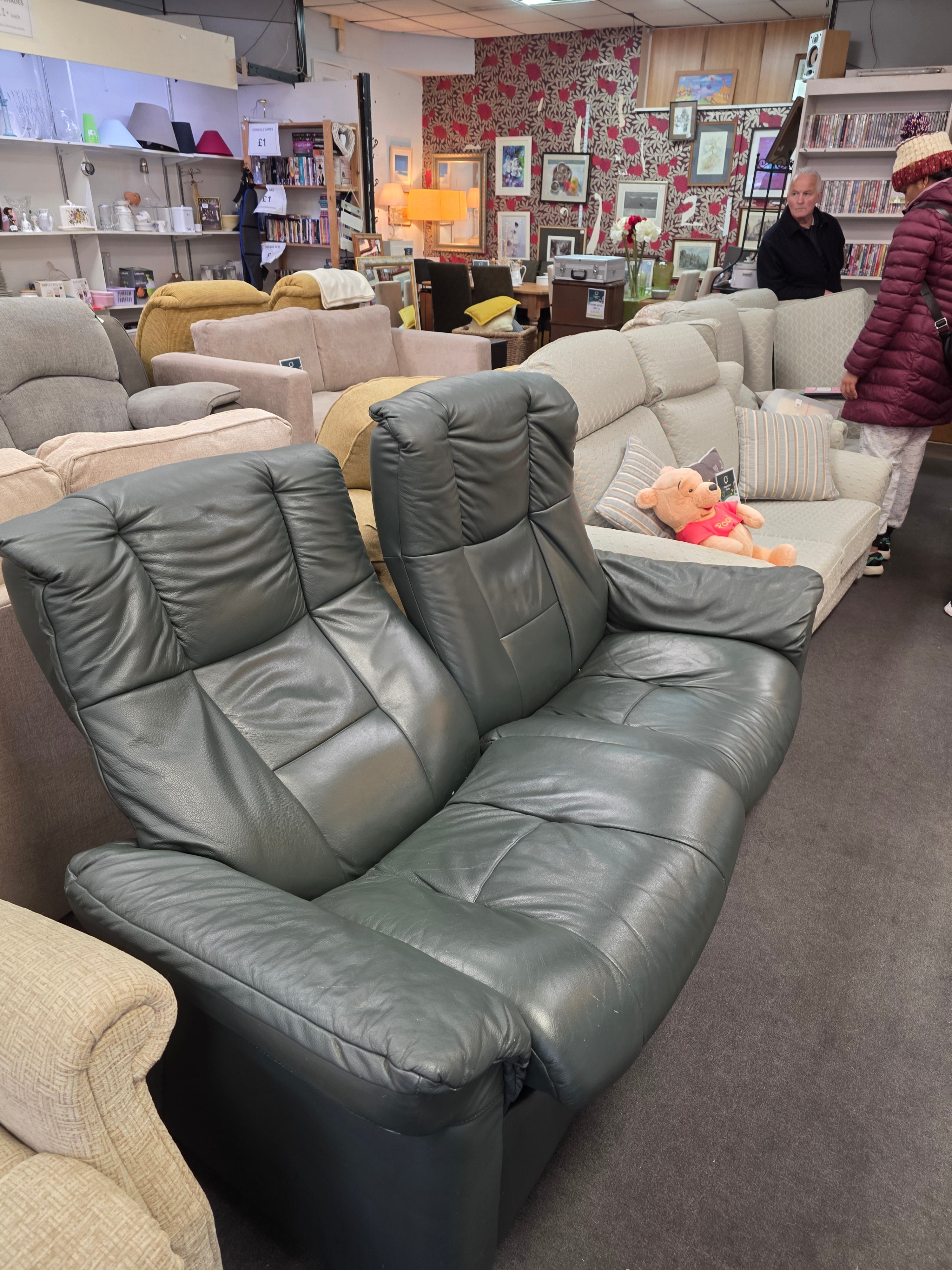 Green Leather 2 seater sofa.