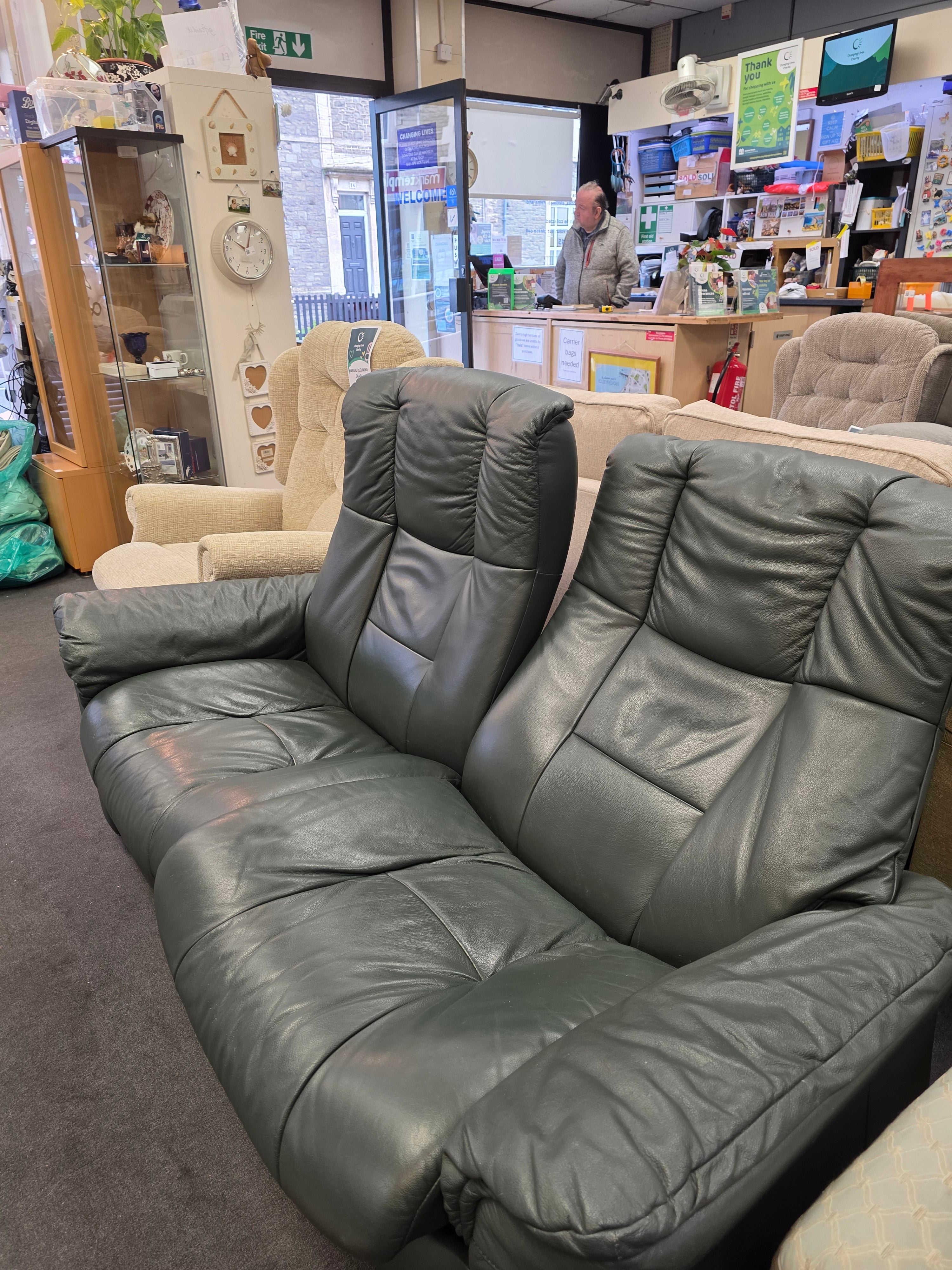 Green Leather 2 seater sofa.